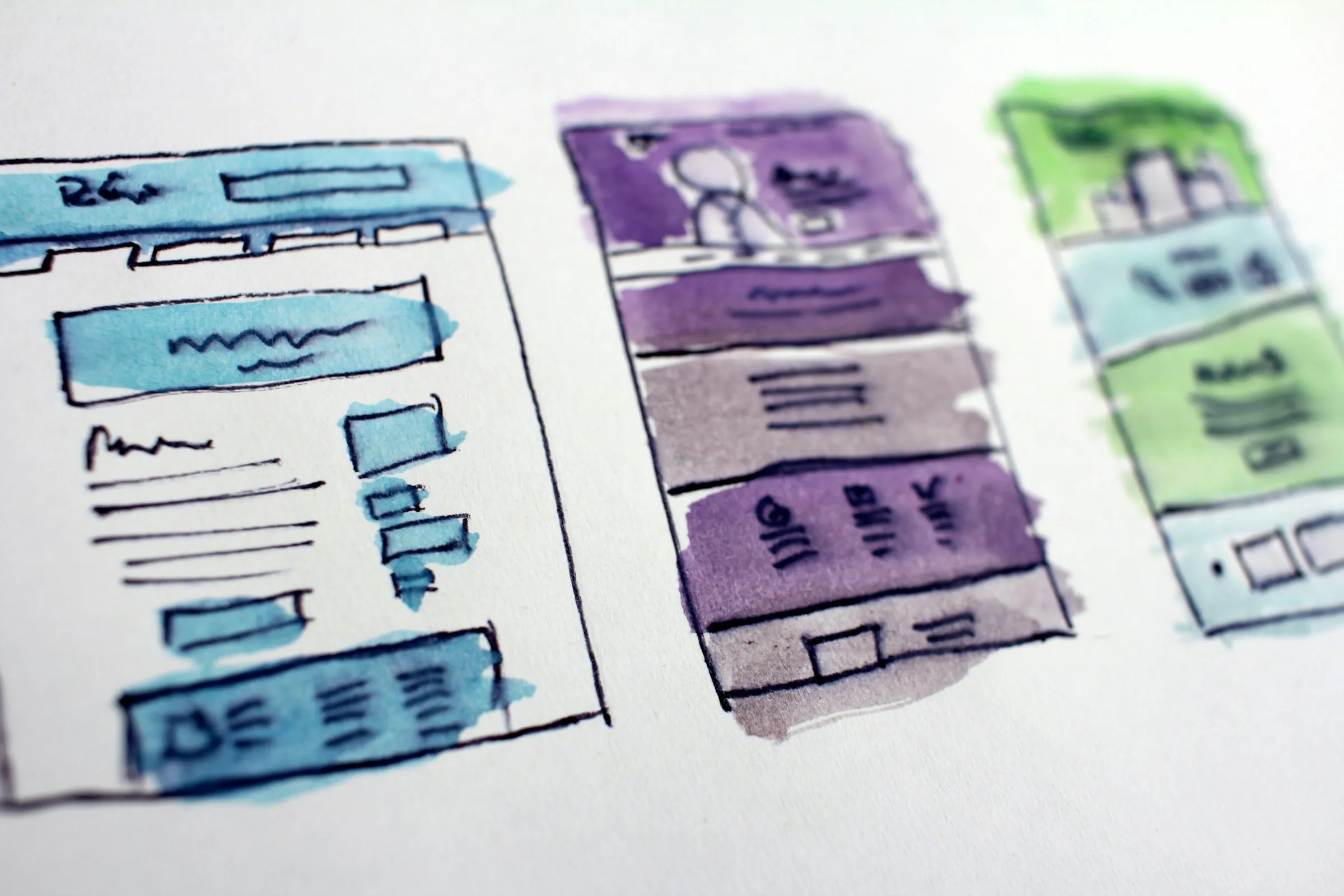 Watercolour sketches of website wireframes